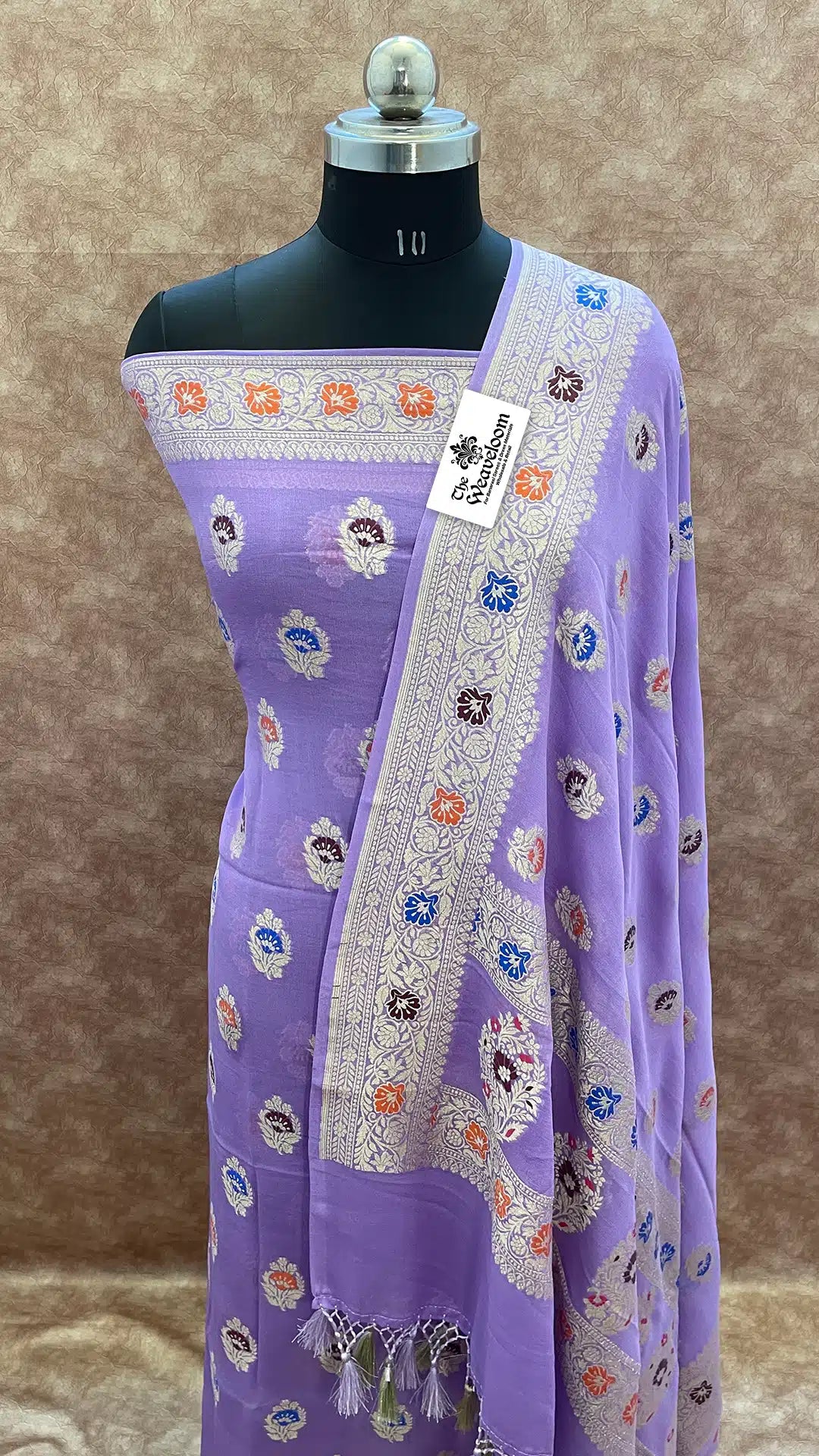 The Weaveloom lavender georgette banarasi dress material with multicolor meenakari motifs and dupatta
