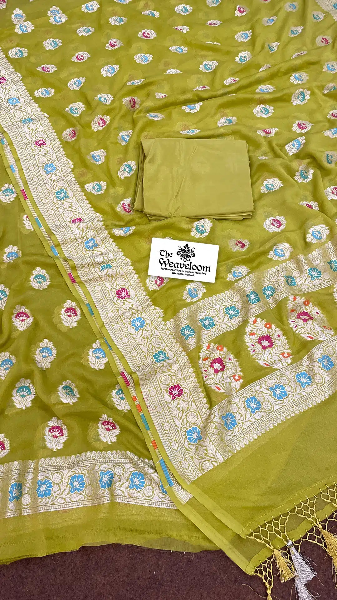 The Weaveloom mehendi green georgette Banarasi dress material with full Meenakari embroidery and unstitched dupatta set