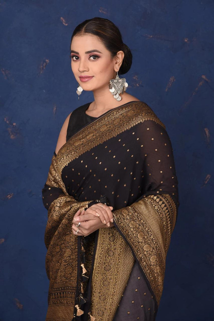 Black Khaddi Georgette Pure Banarasi Saree with antique zari work, showcasing luxurious fabric, elegant draping, and exquisite craftsmanship.