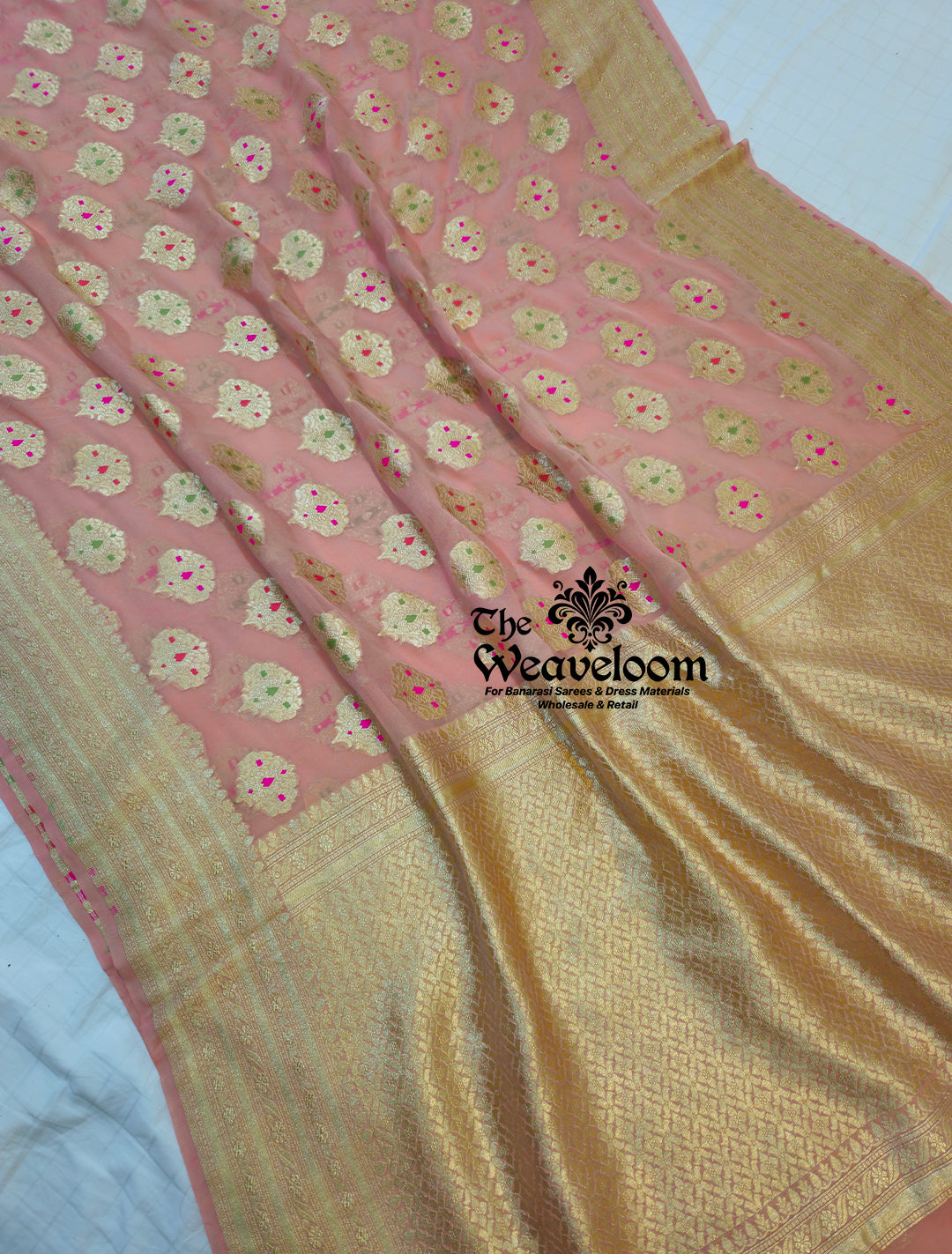 Peach Khaddi Georgette Water Zari Pure Banarasi Saree with Meenakari design, handcrafted with intricate detailing, lightweight fabric, and 100% customizable color options, perfect for weddings and festive occasions.