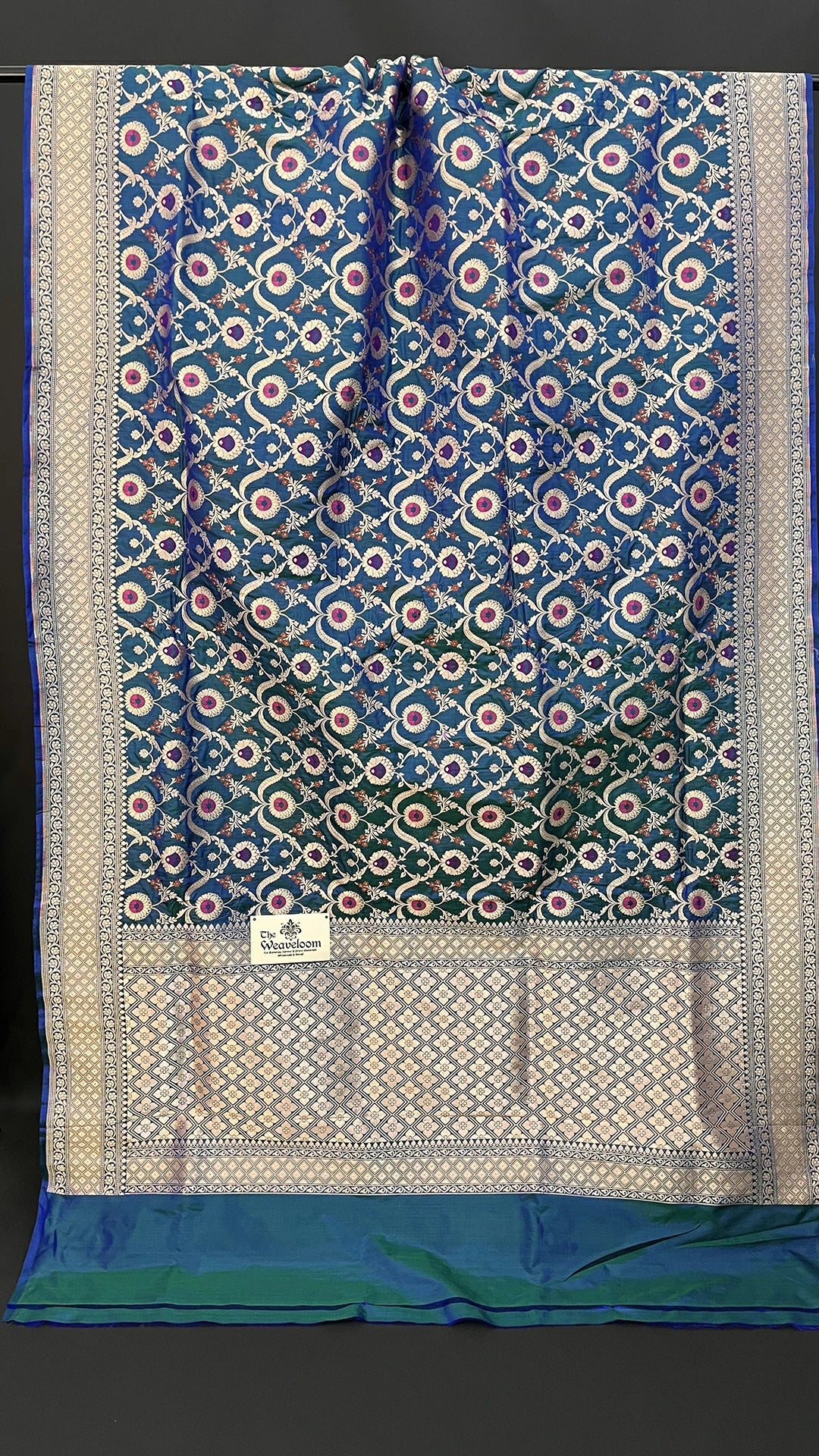 Blue Dual Tone Pure Katan Silk Banarasi Saree With Meenakari Floral Jaal And Silver Zari Border by The Weaveloom