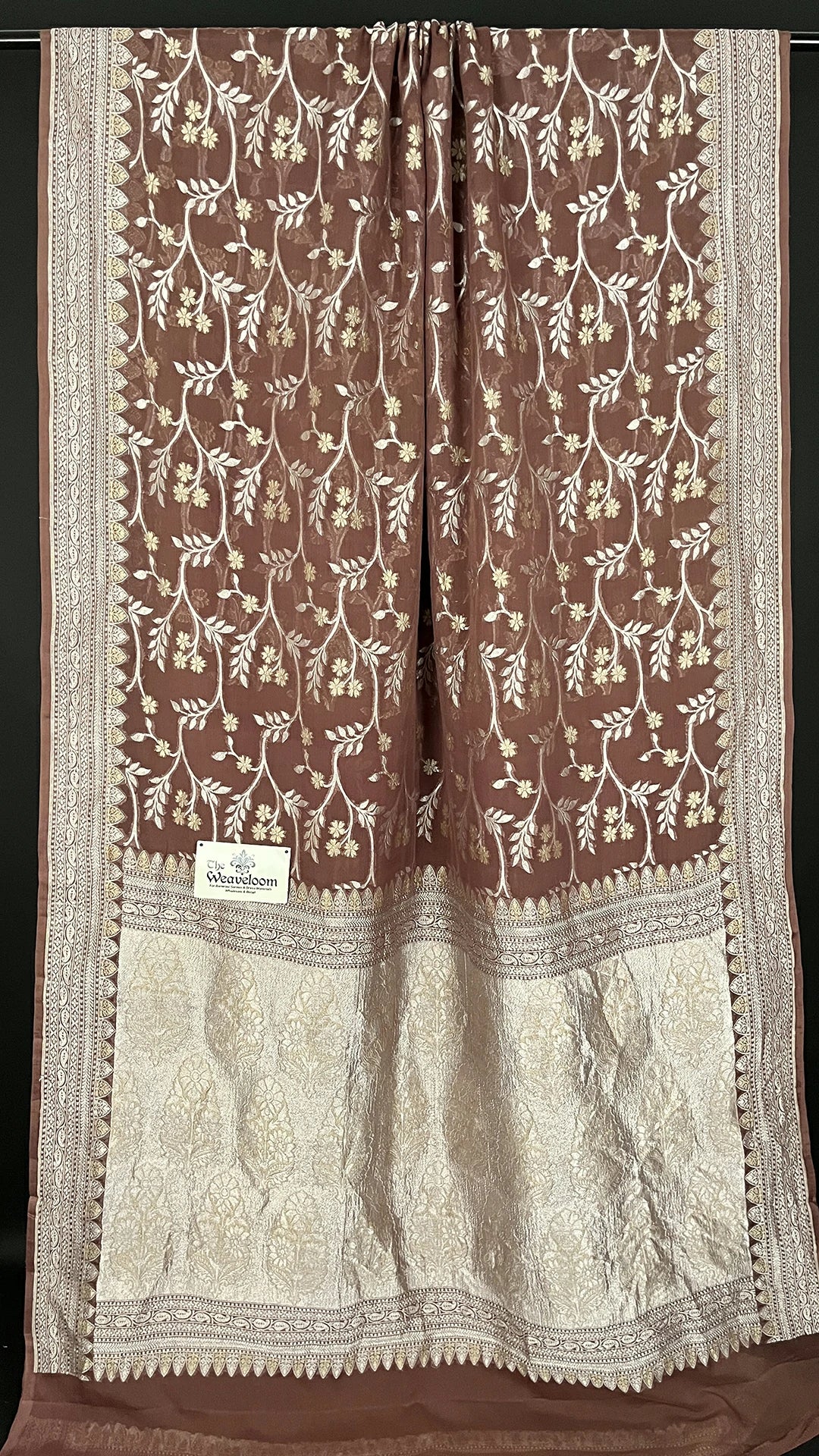 Close-up of Sona Rupa zari floral jaal on brown Khaddi Georgette Banarasi saree