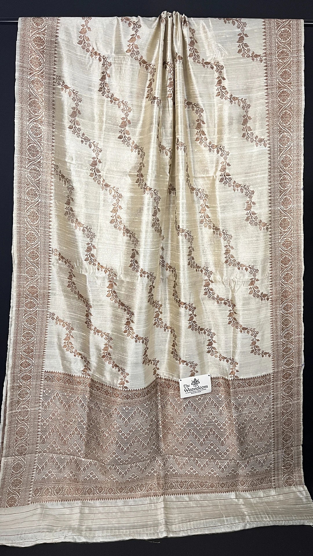 Cream Pure Raw Silk Banarasi Saree with Antique Zari Floral Motifs and Ornate Border by The Weaveloom