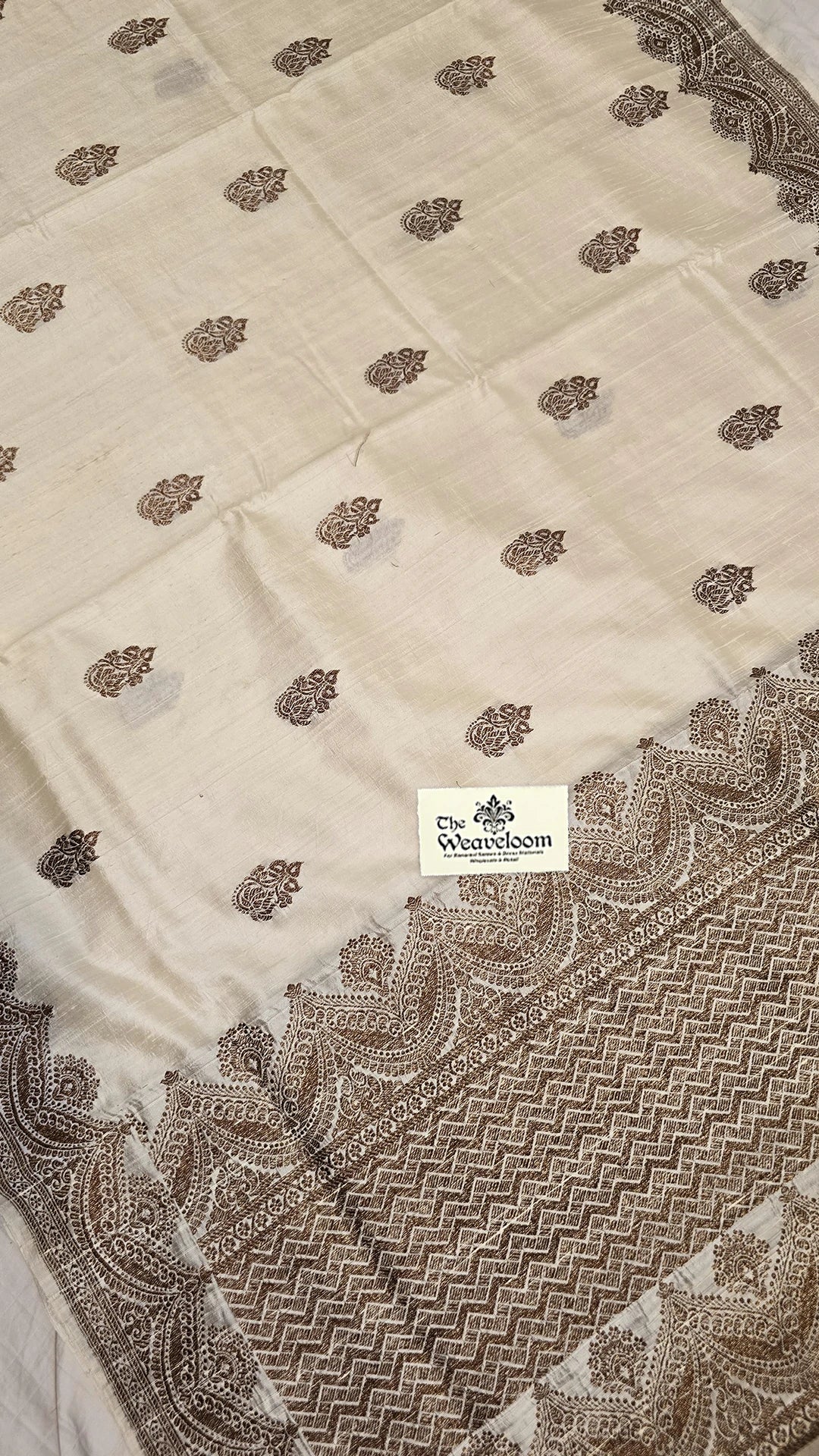 Cream raw silk pure handloom Banarasi saree with antique zari border and buti pattern by The Weaveloom