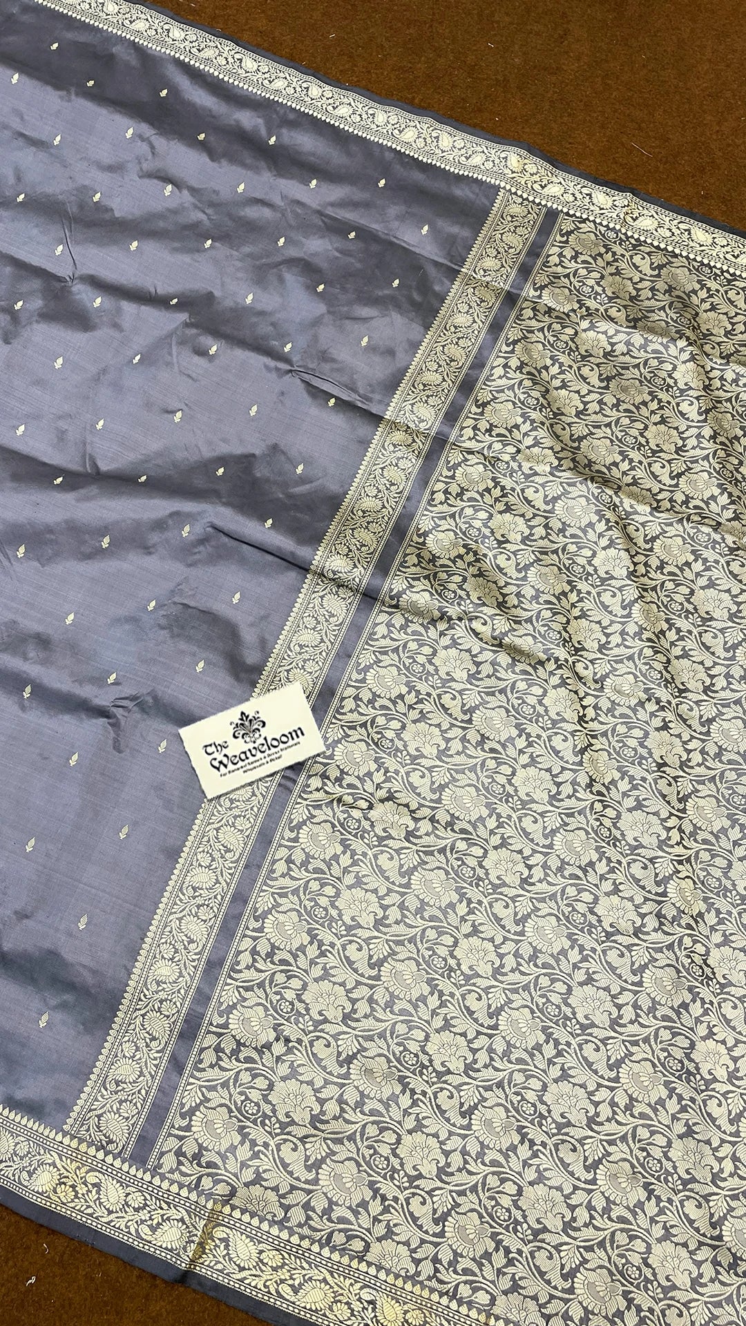 Glossy Grey Pure Katan Silk Handloom Banarasi Saree with Zari Buta and Floral Pallu by The Weaveloom