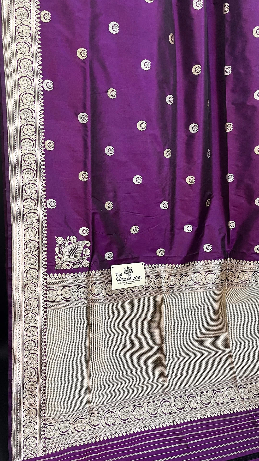 Shop magenta pure Katan silk handloom Banarasi saree with Chand Tara motifs and elegant zari border. A luxurious choice for weddings.
