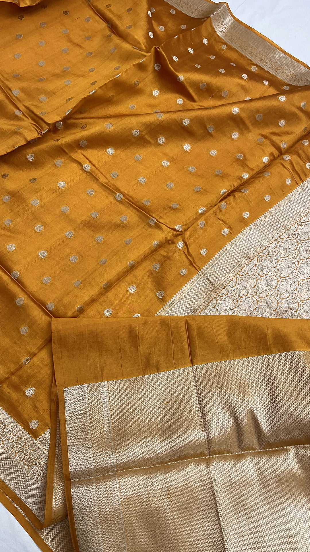 Mustard Pure Dupion Silk Banarasi Saree with silver booti and ivory brocade pallu by The Weaveloom