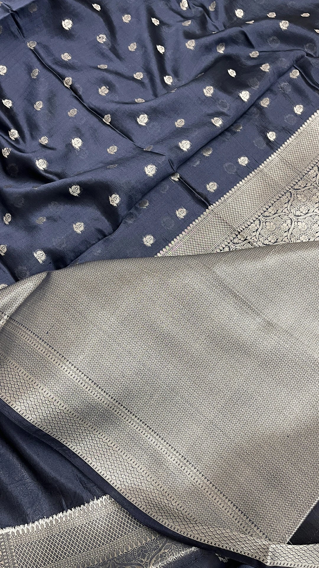 Navy blue pure Dupion silk Banarasi saree with silver buti & brocade pallu by The Weaveloom