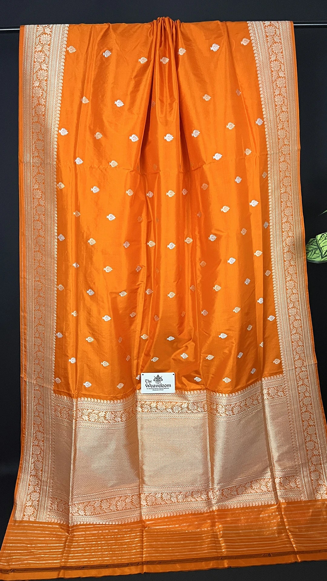 Orange Pure Katan Silk Handloom Banarasi Saree with Silver Zari Floral Border by The Weaveloom