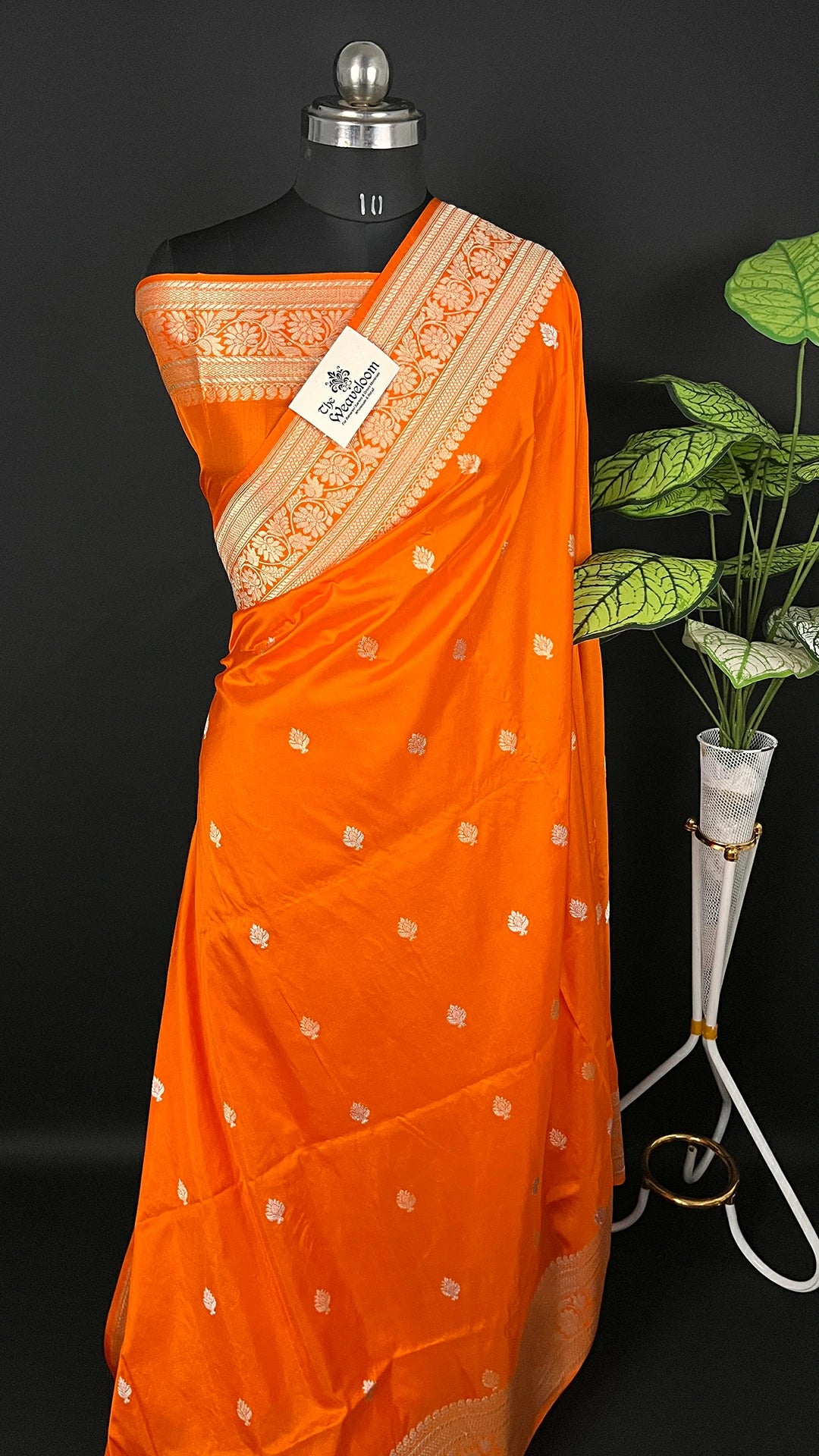Orange Pure Katan Silk Handloom Banarasi Saree with Silver Zari Floral Border by The Weaveloom