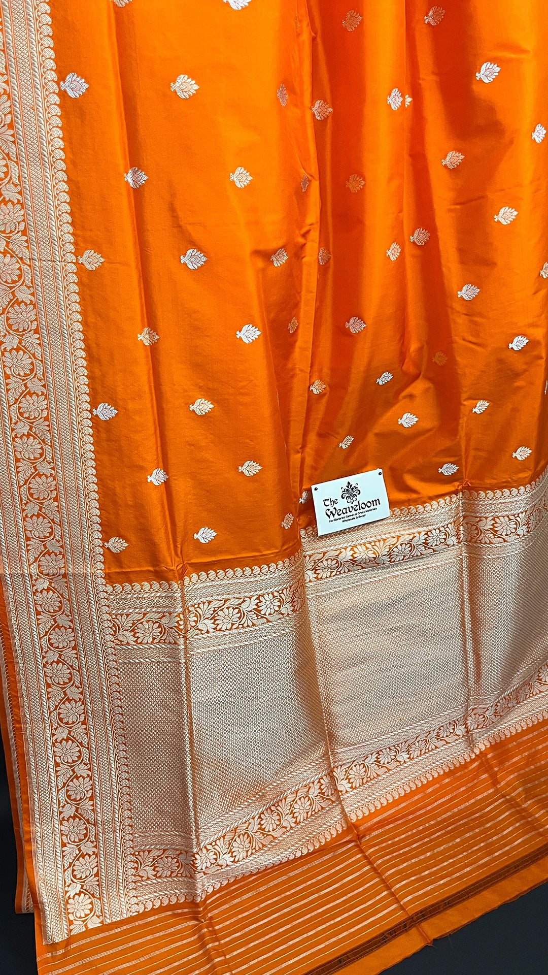Orange Pure Katan Silk Handloom Banarasi Saree with Silver Zari Floral Border by The Weaveloom