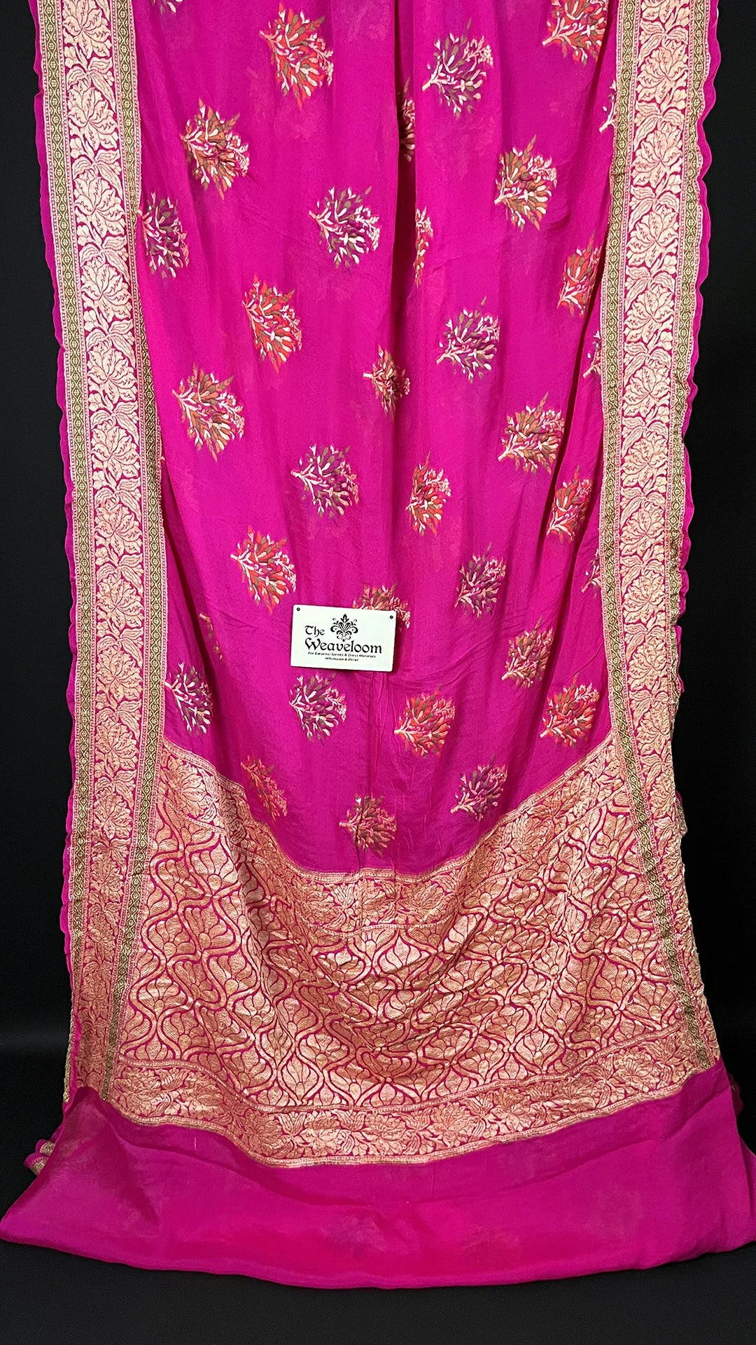 The Weaveloom Rani Pink Crepe Georgette Pure Banarasi Saree with Meenakari Floral Buta and Golden Zari Border