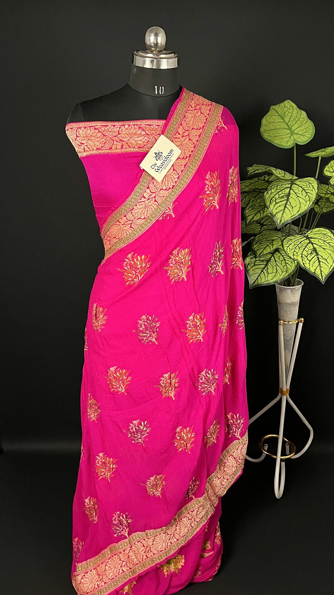 The Weaveloom Rani Pink Crepe Georgette Pure Banarasi Saree with Meenakari Floral Buta and Golden Zari Border