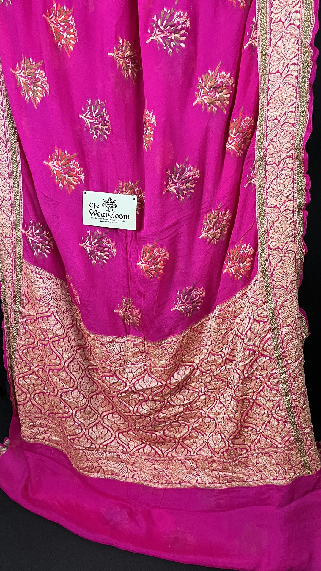 The Weaveloom Rani Pink Crepe Georgette Pure Banarasi Saree with Meenakari Floral Buta and Golden Zari Border