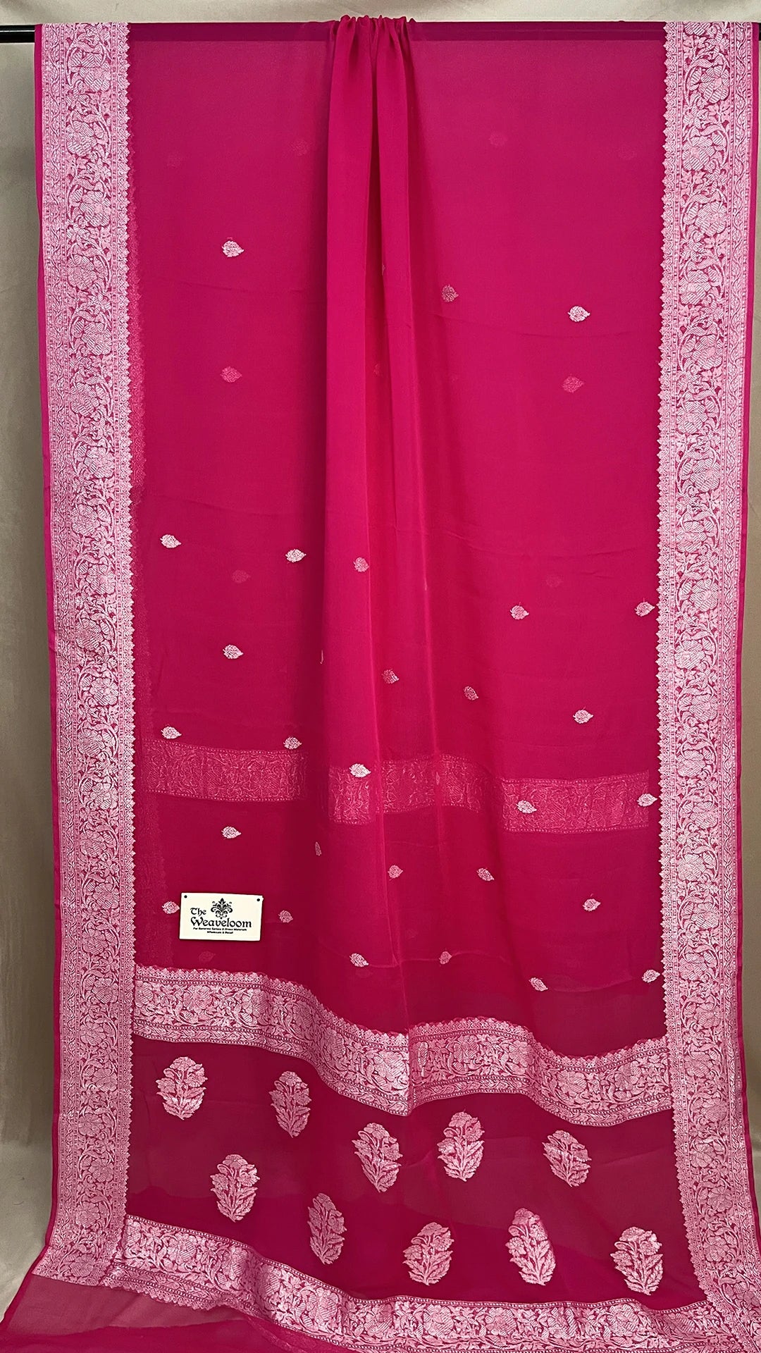 Rani Pink Khaddi Georgette Pure Banarasi Saree with Silver Zari Floral Border by The Weaveloom
