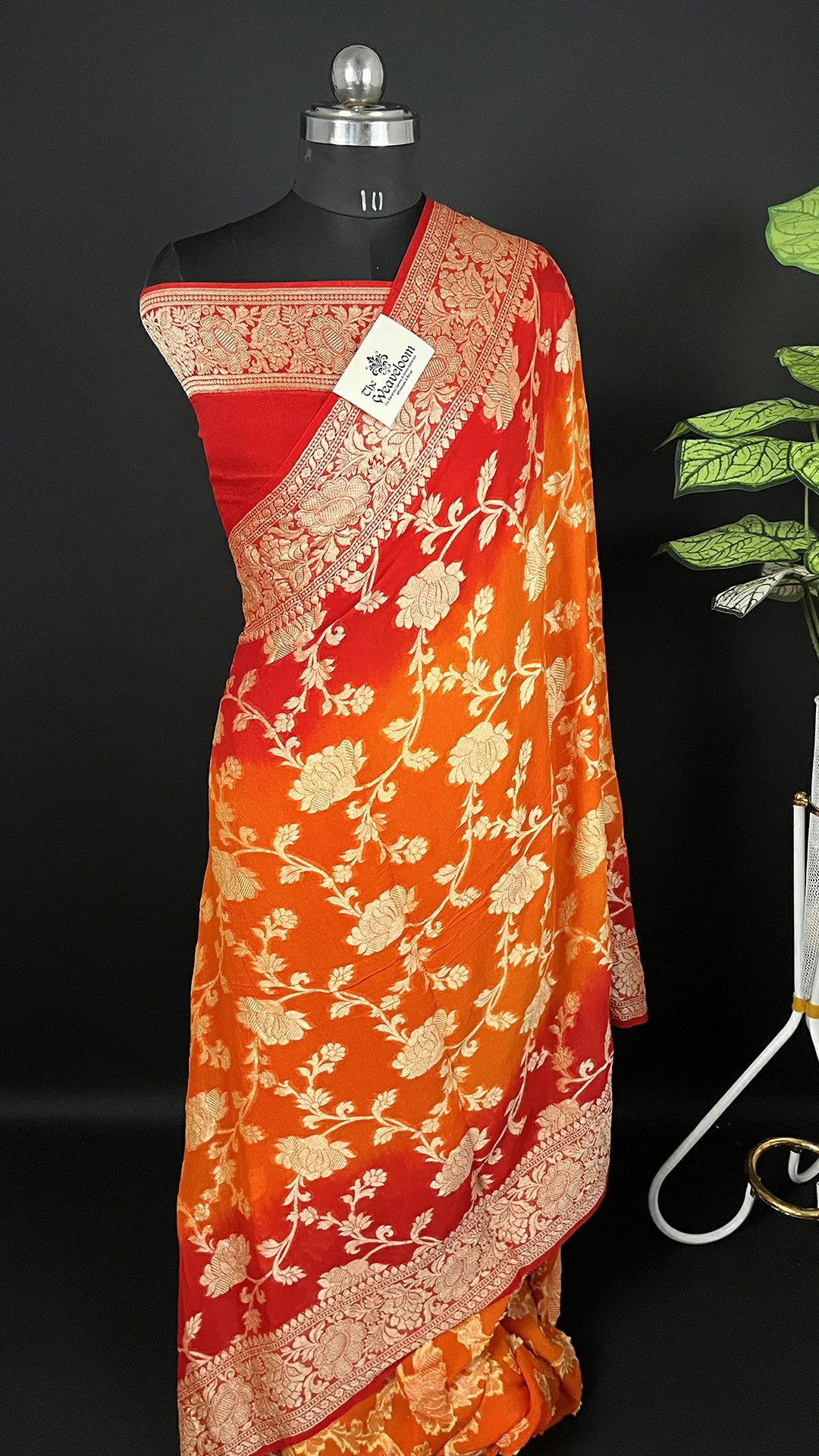 The Weaveloom Rust Orange & Red Pure Crepe Georgette Banarasi Saree with Golden Zari Floral Jaal Work