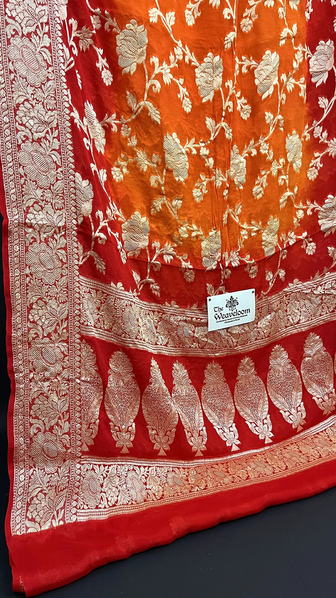 The Weaveloom Rust Orange & Red Pure Crepe Georgette Banarasi Saree with Golden Zari Floral Jaal Work
