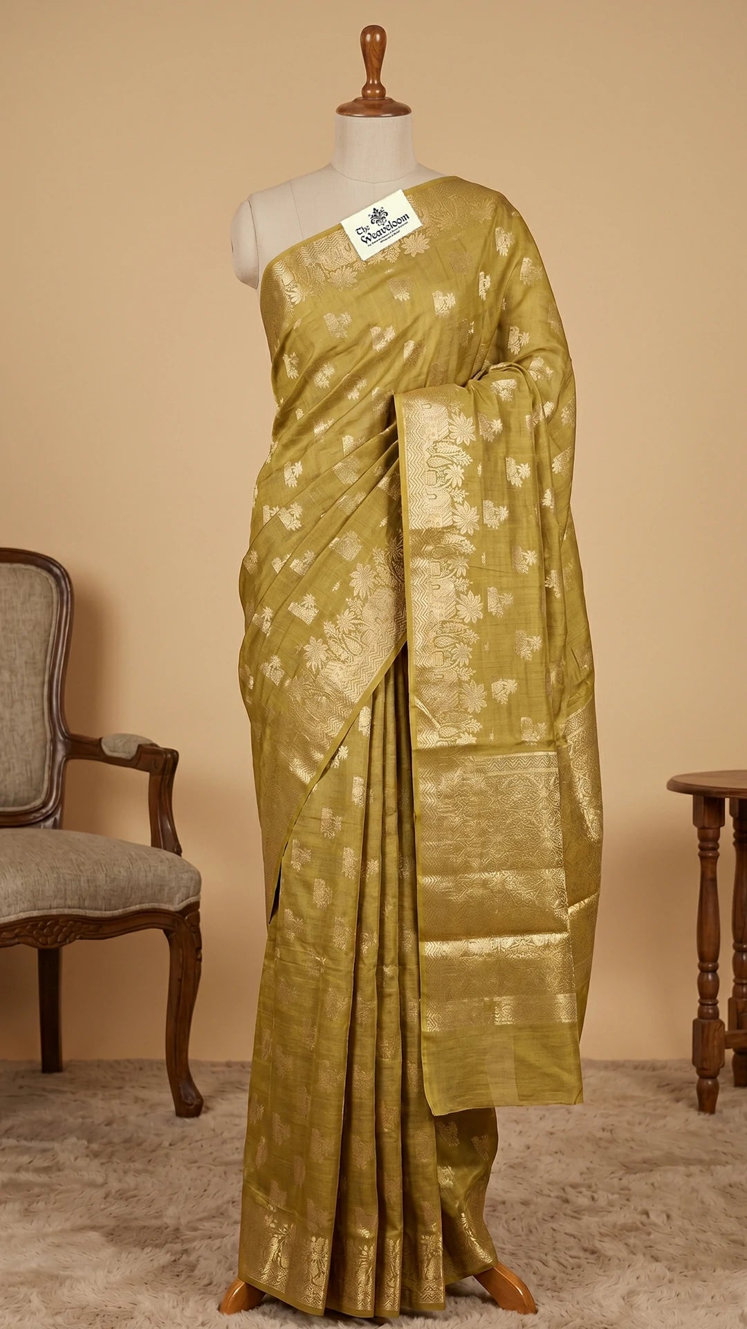 The Weaveloom Dhani Olive Golden Zari Chiniya Silk Pure Banarasi Saree with floral woven border and rich zari pallu