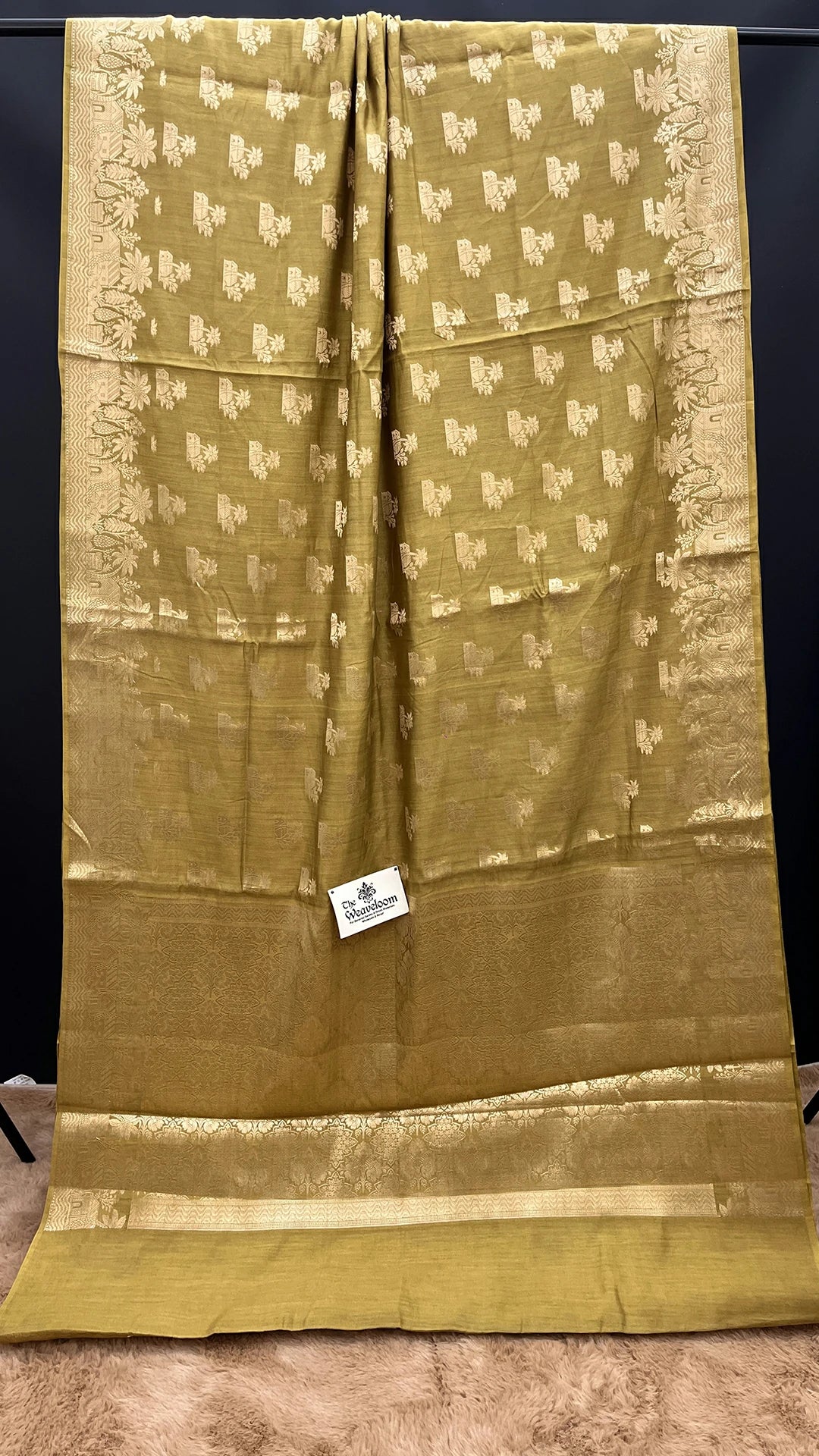 The Weaveloom Dhani Olive Golden Zari Chiniya Silk Pure Banarasi Saree with floral woven border and rich zari pallu