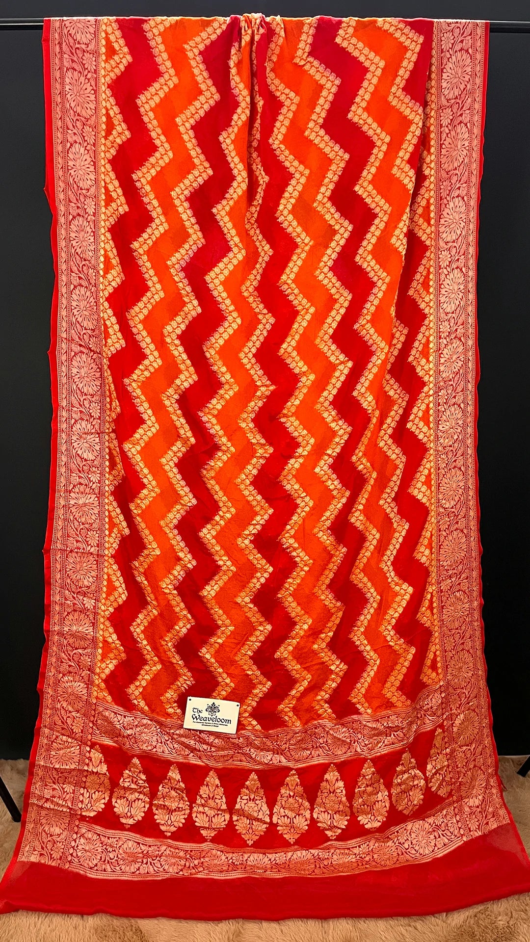 The Weaveloom Fanta Orange Red Rangkat Pattern Pure Crepe Georgette Banarasi Saree with Golden Zari