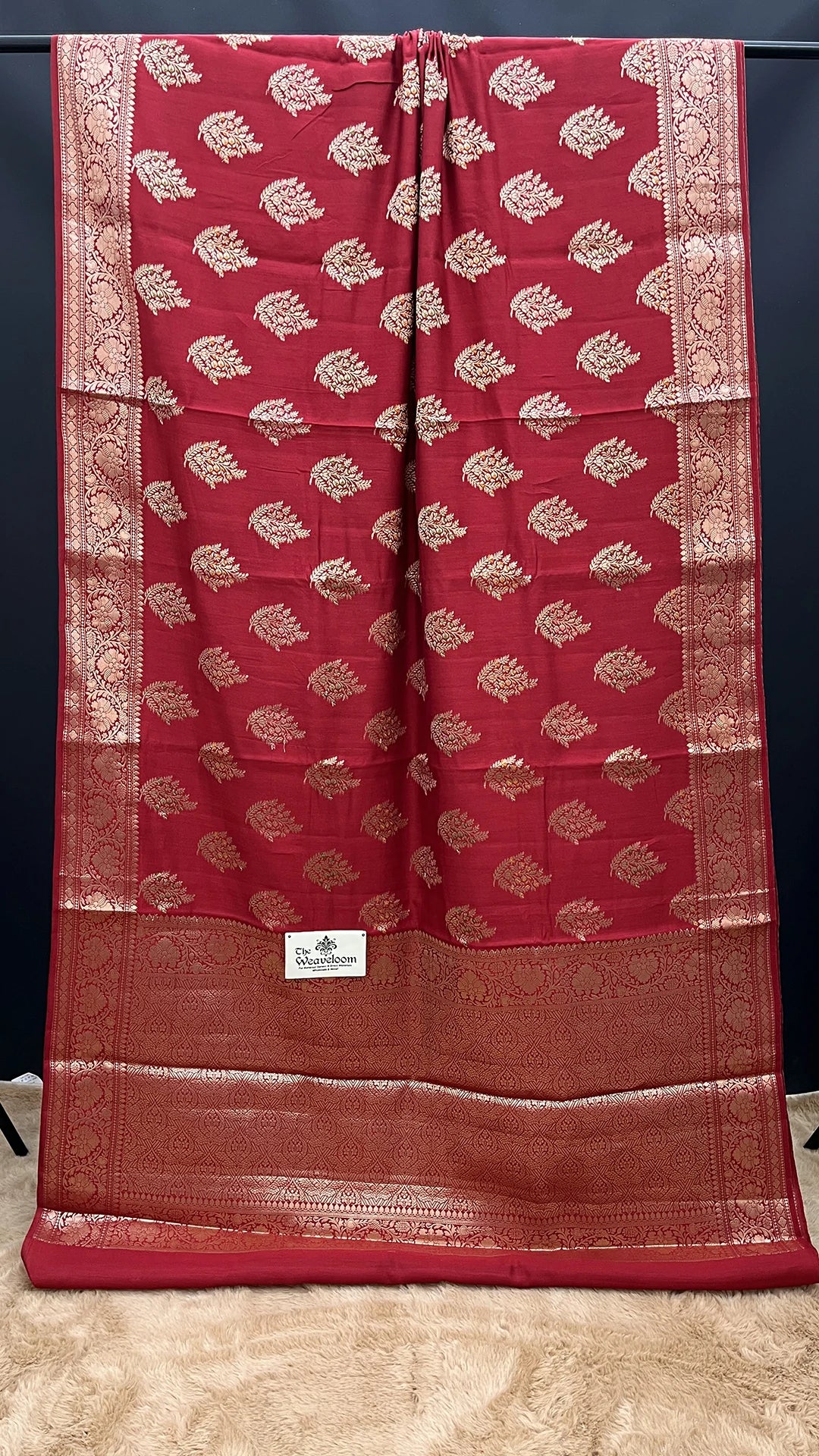 The Weaveloom Maroon Chiniya Silk Pure Banarasi Saree with Golden Meenakari Leaf Buti and Rich Zari Border