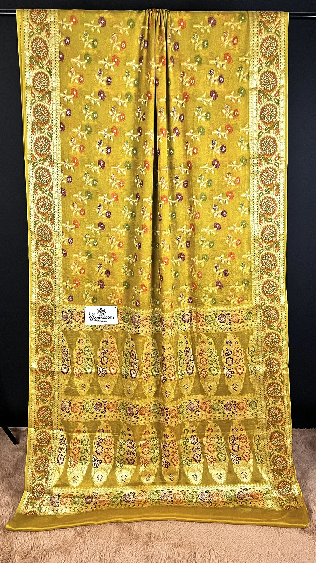 The Weaveloom Mustard Floral Meenakari Pure Khaddi Chiffon Banarasi Saree with Woven Border and Traditional Banarasi Design