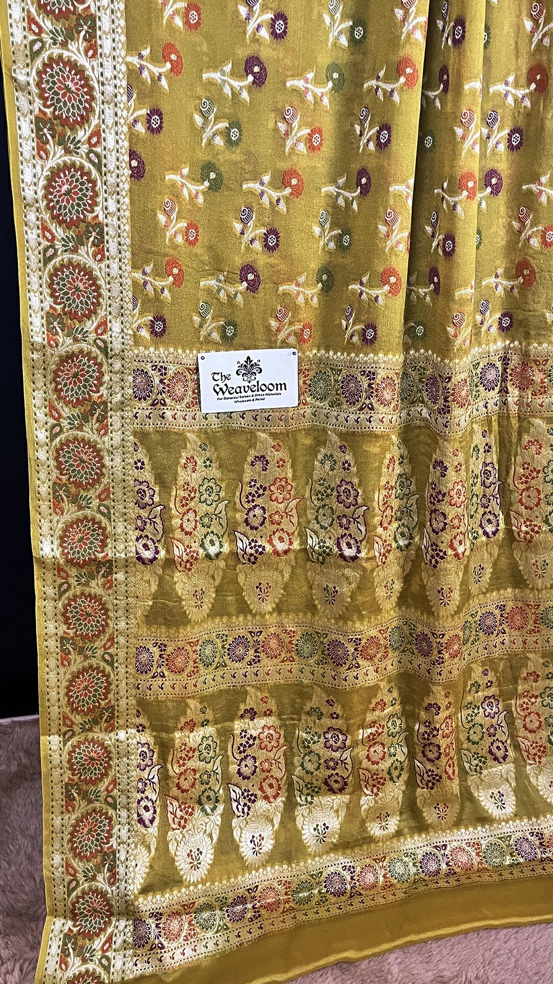 The Weaveloom Mustard Floral Meenakari Pure Khaddi Chiffon Banarasi Saree with Woven Border and Traditional Banarasi Design