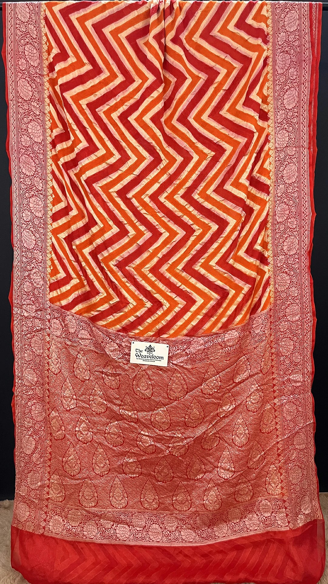 The Weaveloom Orange Fanta Rangkat Chevron Pattern Pure Crepe Georgette Multicolor Banarasi Saree with Golden Zari Border