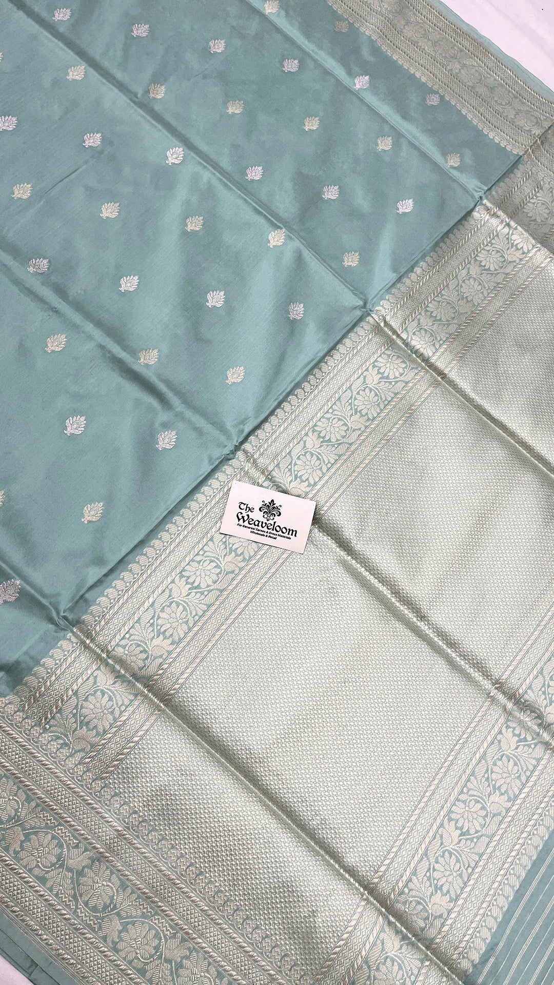 The Weaveloom pista green pure katan silk handloom Banarasi saree with silver zari kadwa border