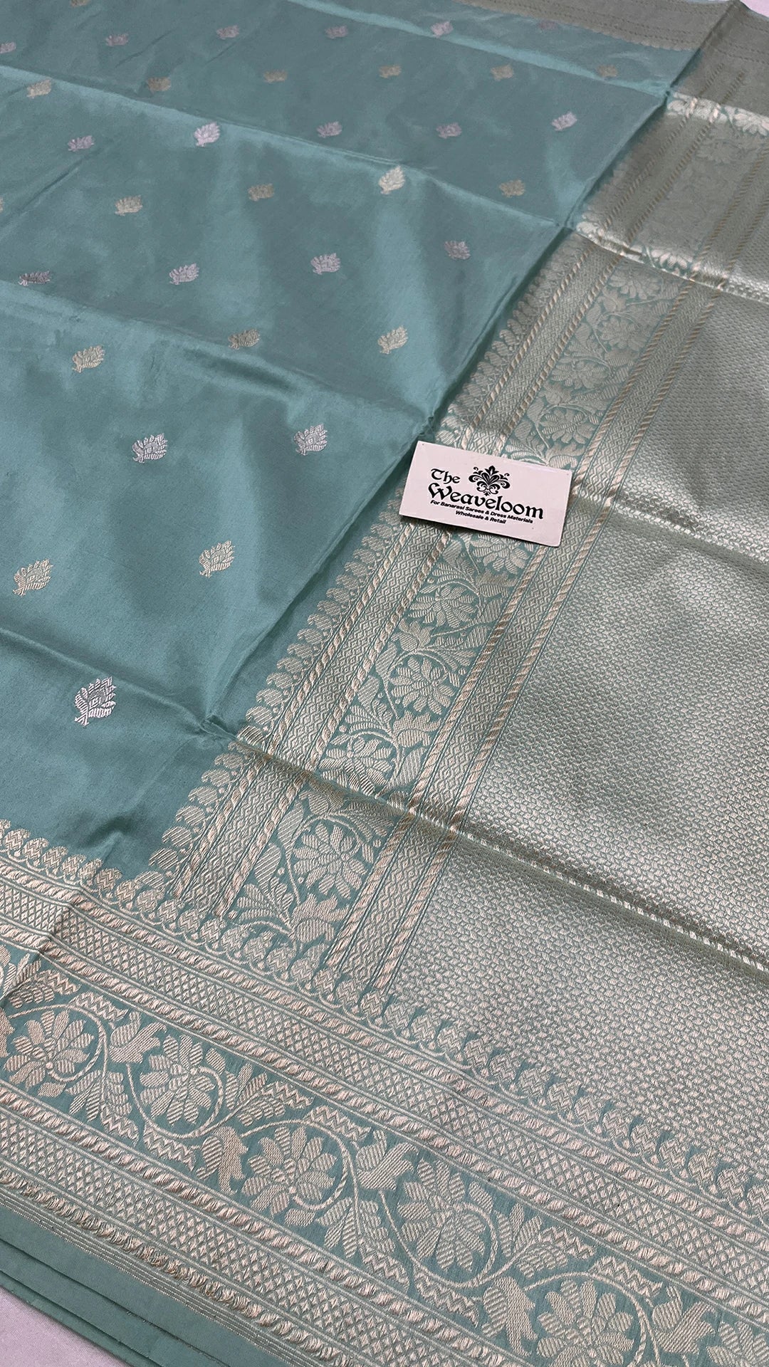 The Weaveloom pista green pure katan silk handloom Banarasi saree with silver zari kadwa border