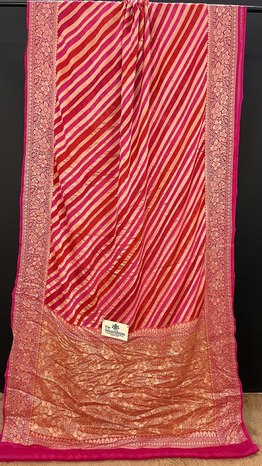 The Weaveloom Rani Pink Rangkat Stripe Crepe Georgette Pure Banarasi Saree With Golden Zari Floral Border